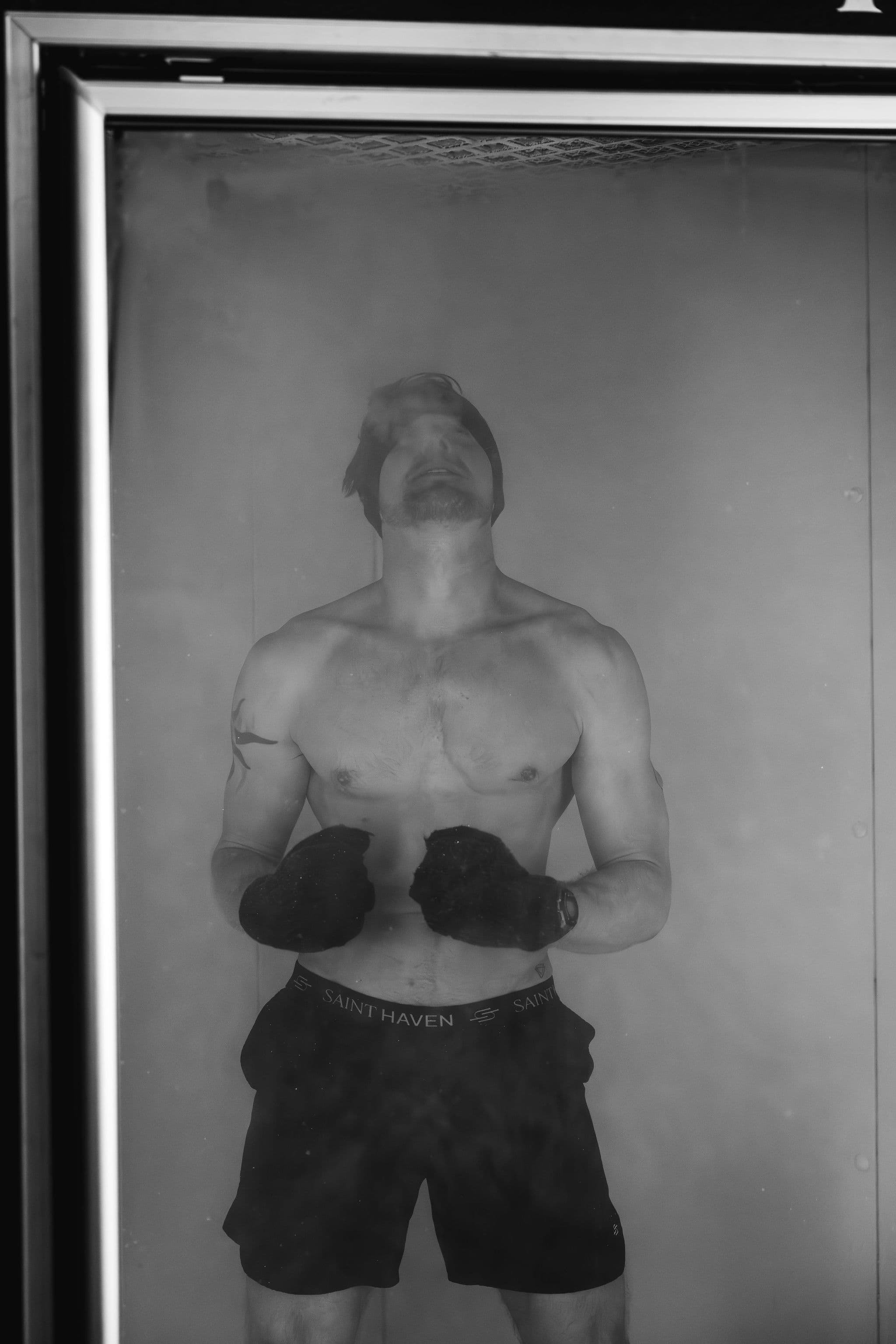 Client standing in a cryotherapy chamber